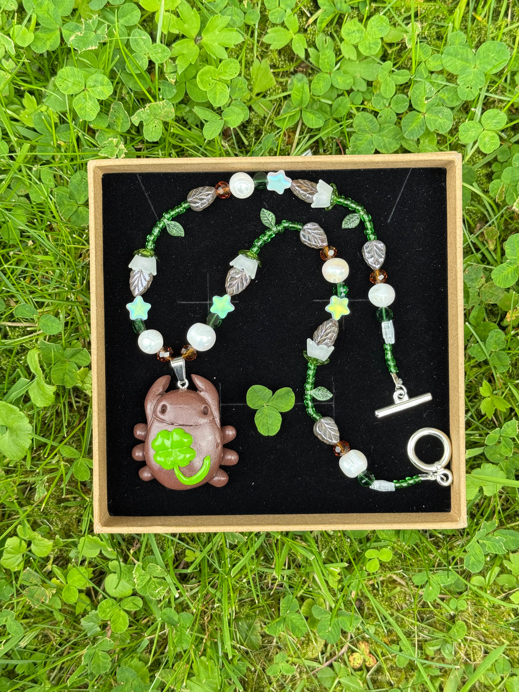 lilly of the valley bug necklace