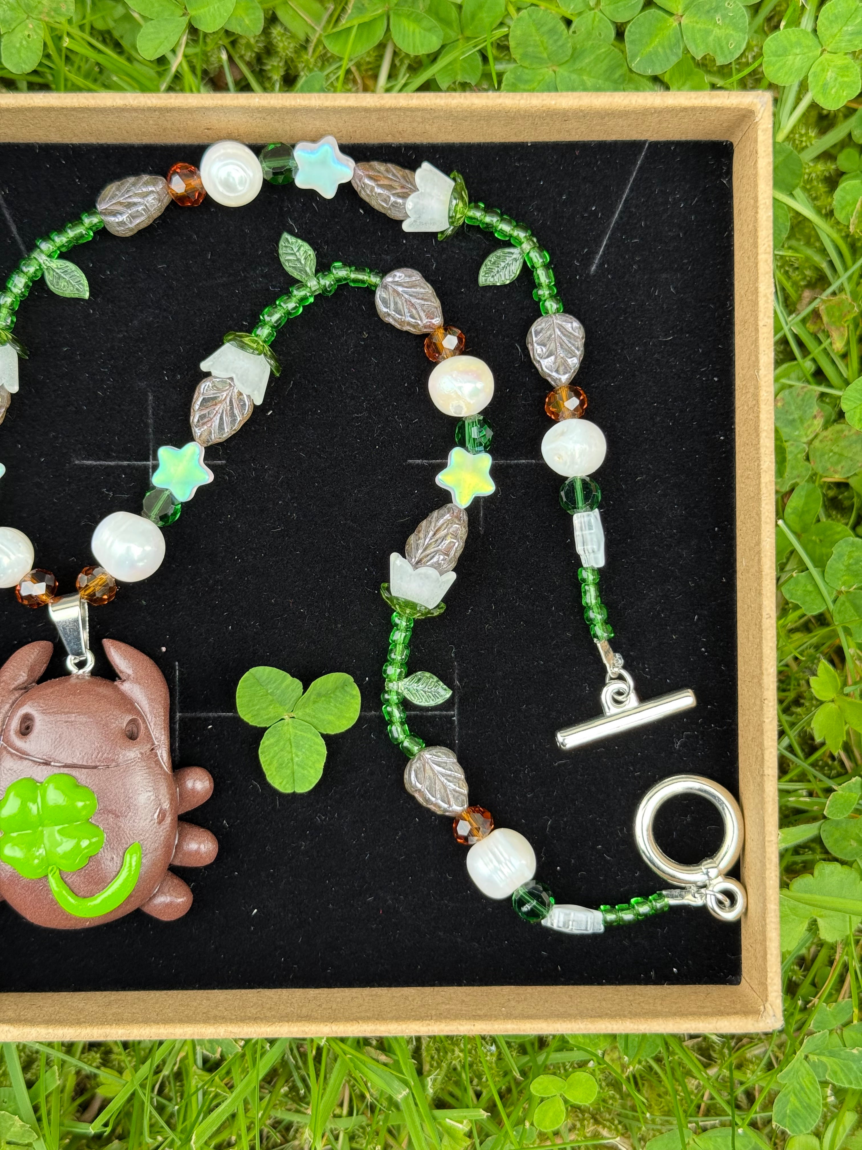lilly of the valley bug necklace