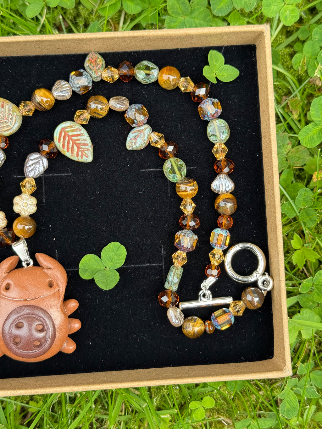 forest button bug necklace