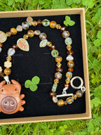forest button bug necklace