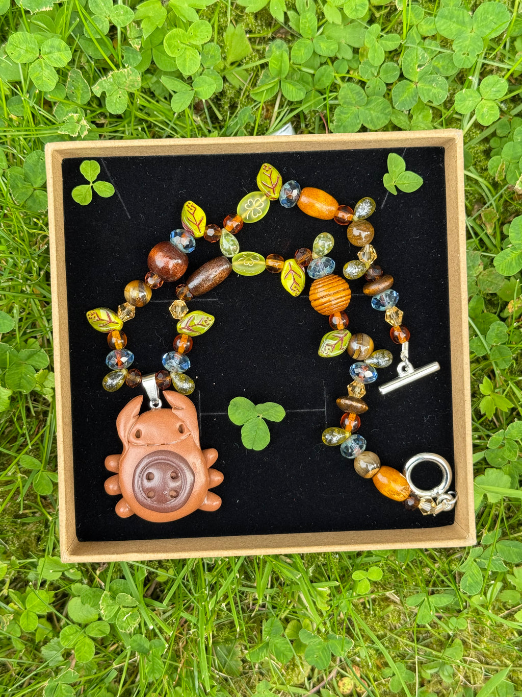 magical forest button bug necklace