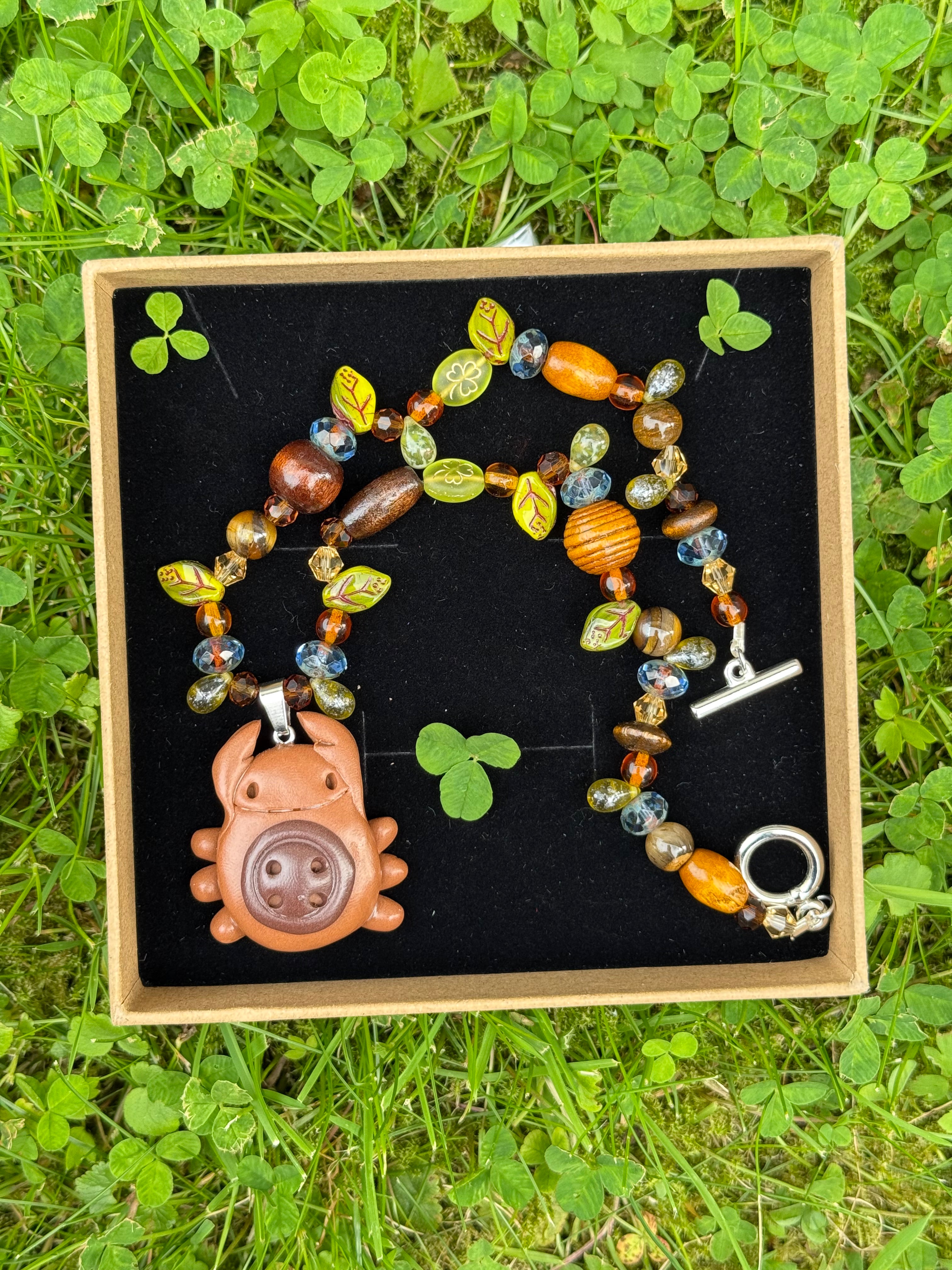 magical forest button bug necklace