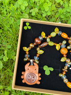 magical forest button bug necklace