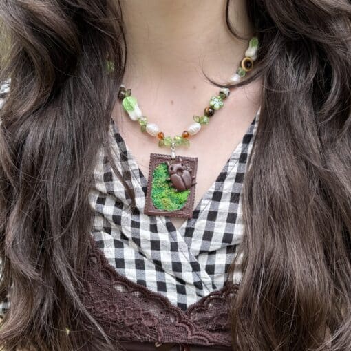 moss spiral bug necklace