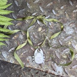 green ribbon bug neckklace